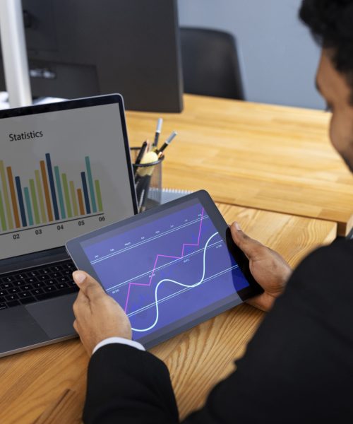 business-person-looking-finance-graphs business-person-looking-finance-graphs